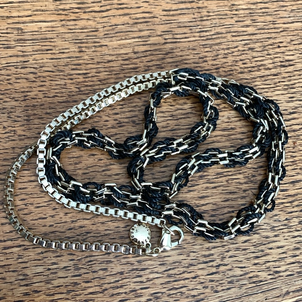 BCBG Generation gold tone and black chord 34” necklace in good condition